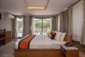 Letto o letti in una camera di Hotel Raniban Arcade