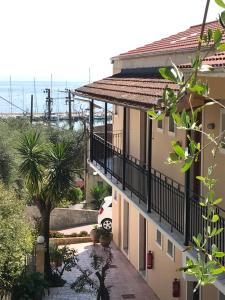 an apartment building with a view of the ocean at Sofia Studios in Benitses