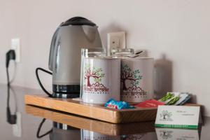 Set per la preparazione di tè e caffè presso Hotel Raniban Arcade