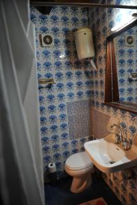 a bathroom with a toilet and a sink at Eleonora in Chania Town +35 photos