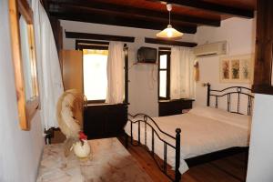 a bedroom with a bed in a room at Eleonora in Chania Town
