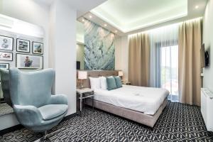 Posteľ alebo postele v izbe v ubytovaní Hotel Atelia