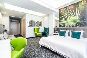 Posteľ alebo postele v izbe v ubytovaní Hotel Atelia