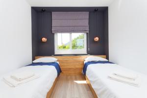 Posteľ alebo postele v izbe v ubytovaní Žal Beach Apartments