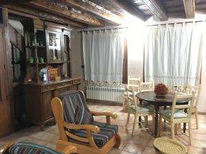 a dining room with a table and chairs at El Pajar del Castillo in Mora de Rubielos