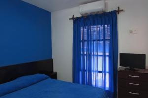 Postel nebo postele na pokoji v ubytování Hostel de los Colores