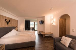 Postel nebo postele na pokoji v ubytování Hotel Möderle
