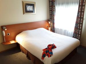 Postel nebo postele na pokoji v ubytování In Situ Hotel
