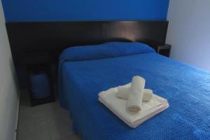 Postel nebo postele na pokoji v ubytování Hostel de los Colores