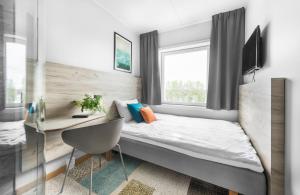 Postel nebo postele na pokoji v ubytování ArenaHotellet i Uppsala
