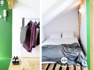 um quarto com uma cama e uma parede verde em WAM Rooms em Giżycko