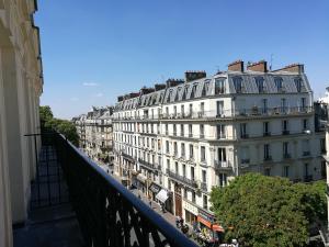 a view of a building from a balcony at Hotel Claude Bernard Saint-Germain in Paris