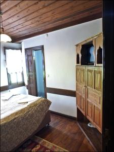 a bedroom with a bed and a dresser at Cakiroglu Konak in Safranbolu