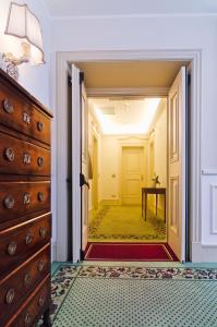A bed or beds in a room at Hotel De Paris Sanremo