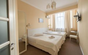 Postel nebo postele na pokoji v ubytování light hotel & hub