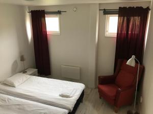 Postel nebo postele na pokoji v ubytování Fjord Apartments & Hostel Rooms