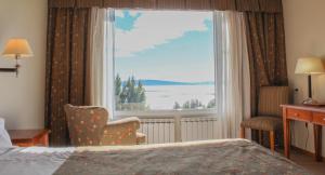 Cama ou camas em um quarto em Terrazas Del Calafate