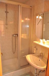 a bathroom with a shower and a sink at Apartments Bogensperger in Mariapfarr +34 photos