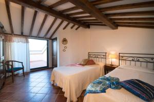 Ein Bett oder Betten in einem Zimmer der Unterkunft Casa Lari