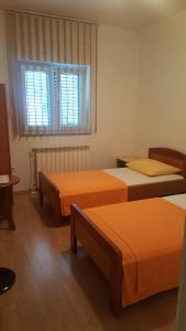 Postel nebo postele na pokoji v ubytování Apartments Barbara