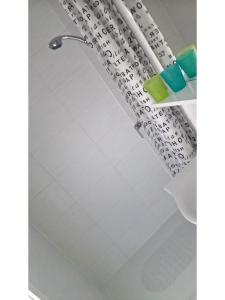 a shower curtain in a bathroom at San Eleuterio Guesthouse in Poreč