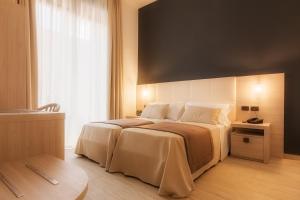 Postel nebo postele na pokoji v ubytování B&B Mariella's House