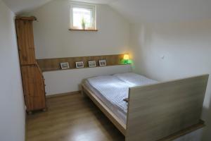 En eller flere senge i et værelse på Jednorodzinny Dom Westchnień w Dziwnowie