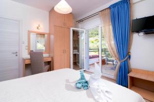 Olive Garden Villas and Apartments客房内的一张或多张床位