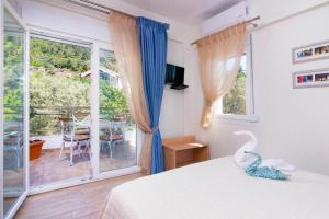 Olive Garden Villas and Apartments客房内的一张或多张床位