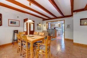 a kitchen and dining room with a wooden table and chairs at Family House Lana in Osor