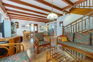 a living room with a couch and a tv at Family House Lana in Osor