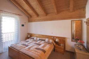 Postel nebo postele na pokoji v ubytování Hotel Vallechiara