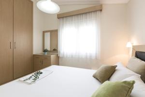 Postel nebo postele na pokoji v ubytování Olive Tree Apartments