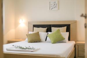 Postel nebo postele na pokoji v ubytování Olive Tree Apartments