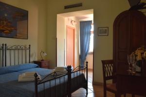 Postel nebo postele na pokoji v ubytování Hotel Risorgimento