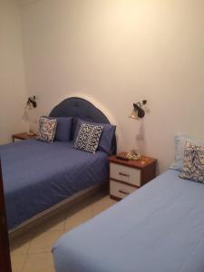 En eller flere senge i et værelse på Casetta Anacaprese