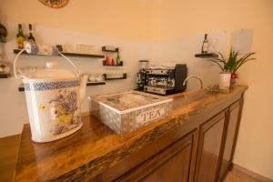 a kitchen with a counter with a table with a blender at Albergo Della Corte in Pescasseroli