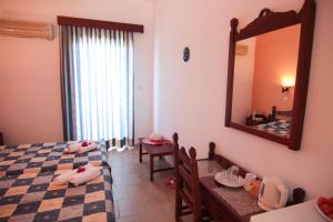 Postel nebo postele na pokoji v ubytování Lofos Hotel + 37 fotografií