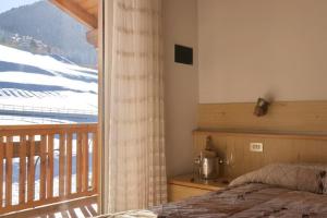 Postel nebo postele na pokoji v ubytování Hotel Vallechiara