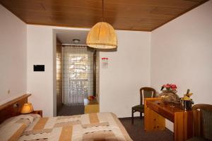 Postel nebo postele na pokoji v ubytování Hotel Vallechiara