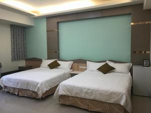 Postel nebo postele na pokoji v ubytování Lucky Bear Guesthouse
