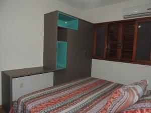 En eller flere senge i et værelse på Casa Praia Mole
