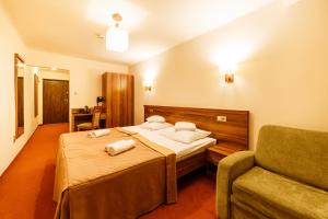 Hotel Sanvit Lake Resort & Spa客房内的一张或多张床位