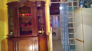 a large wooden cabinet in a kitchen with a door at The Merchant of Venice in Venice