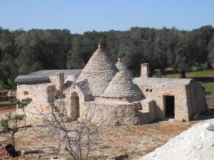 Un antiguo edificio de piedra con techo en Casa Zappa D'argento in Salento, en Francavilla Fontana 35 fotos más