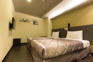 Postel nebo postele na pokoji v ubytování Chance Hotel
