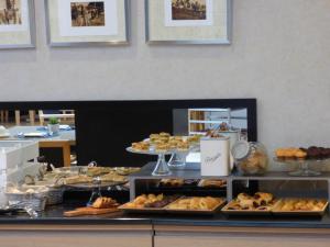 a buffet with many different types of pastries and desserts at Vincci Selección Posada del Patio in Málaga