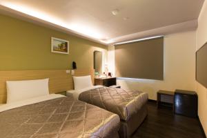 Postel nebo postele na pokoji v ubytování Chance Hotel