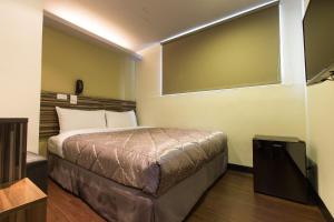 Postel nebo postele na pokoji v ubytování Chance Hotel