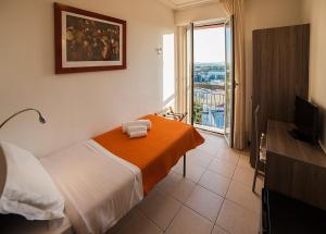 Postel nebo postele na pokoji v ubytování Hotel Madison